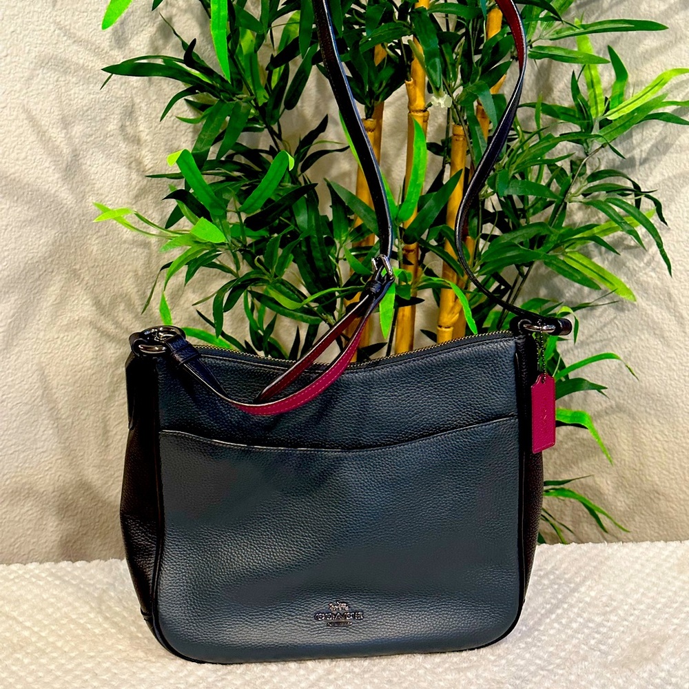 Barely used Coach Crossbody. Dark green with adjustable strap.